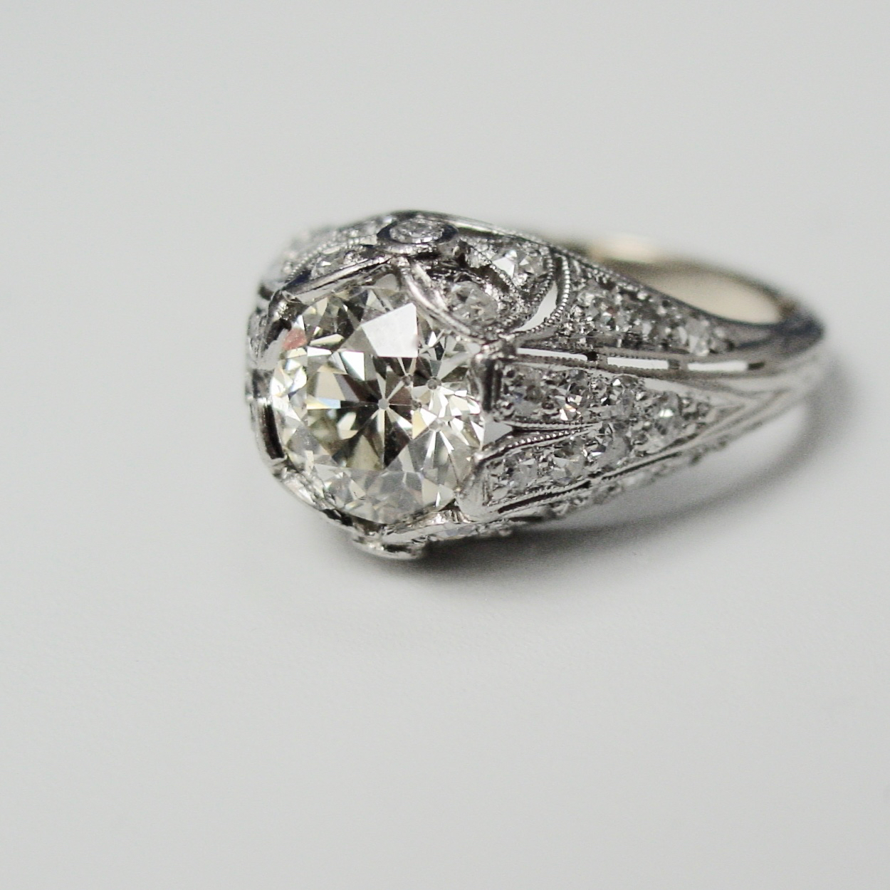 A diamond ring is shown on top of the table.