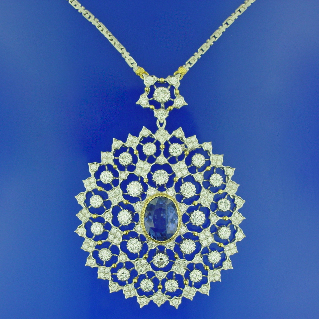 A necklace with a blue stone on it