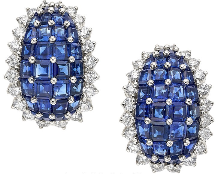 A pair of blue and white diamond earrings.