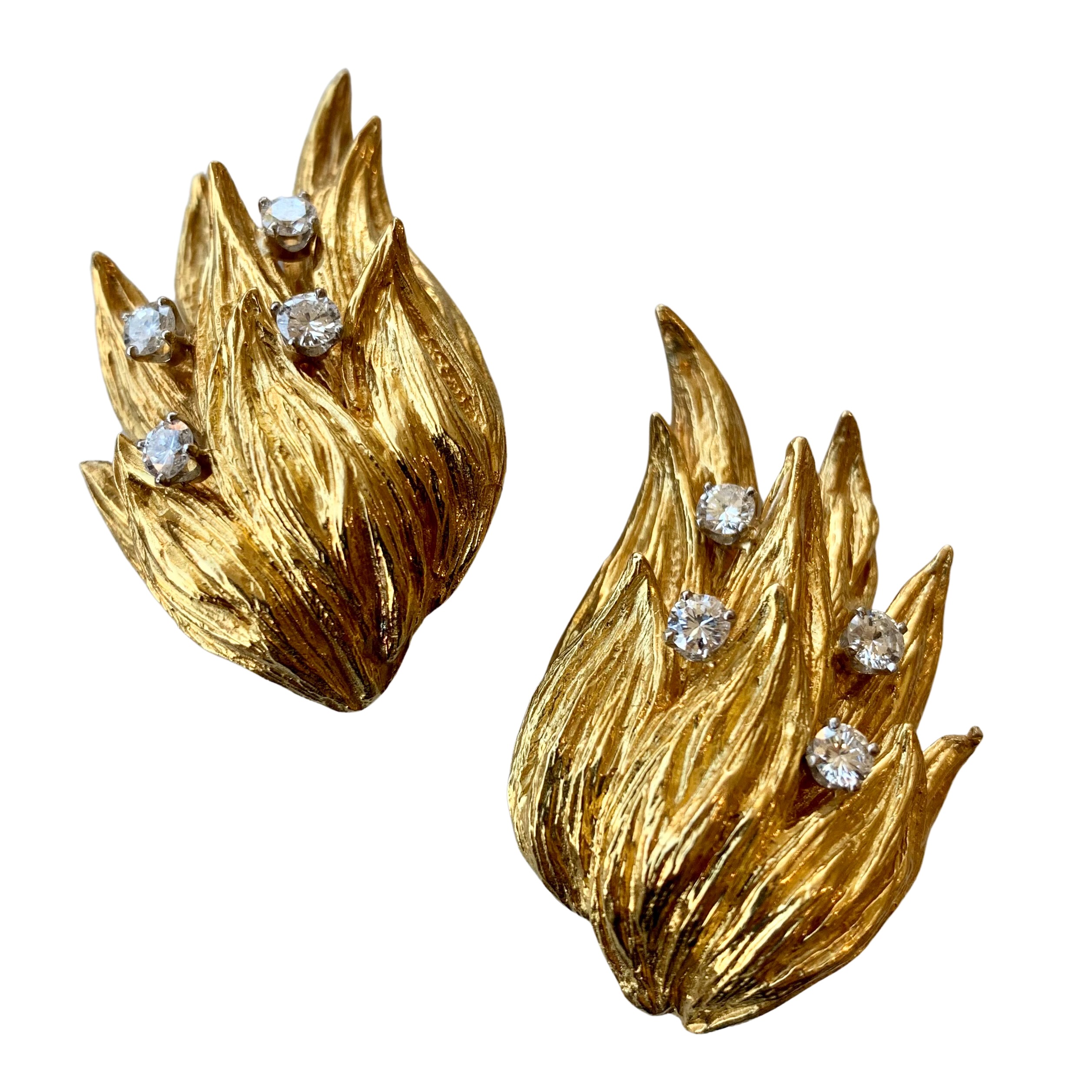 A pair of gold and diamond earrings.