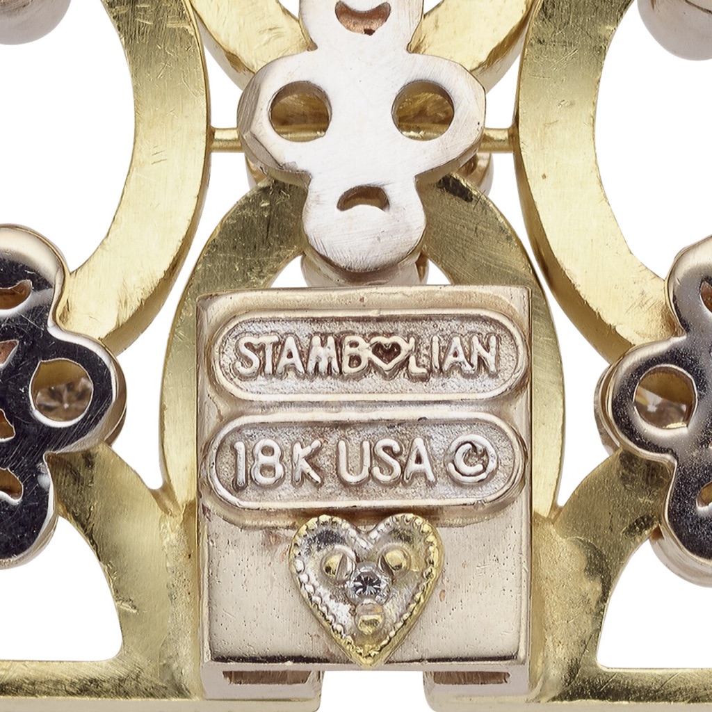 A close up of the stambojan 1 8 k gold and diamond ring