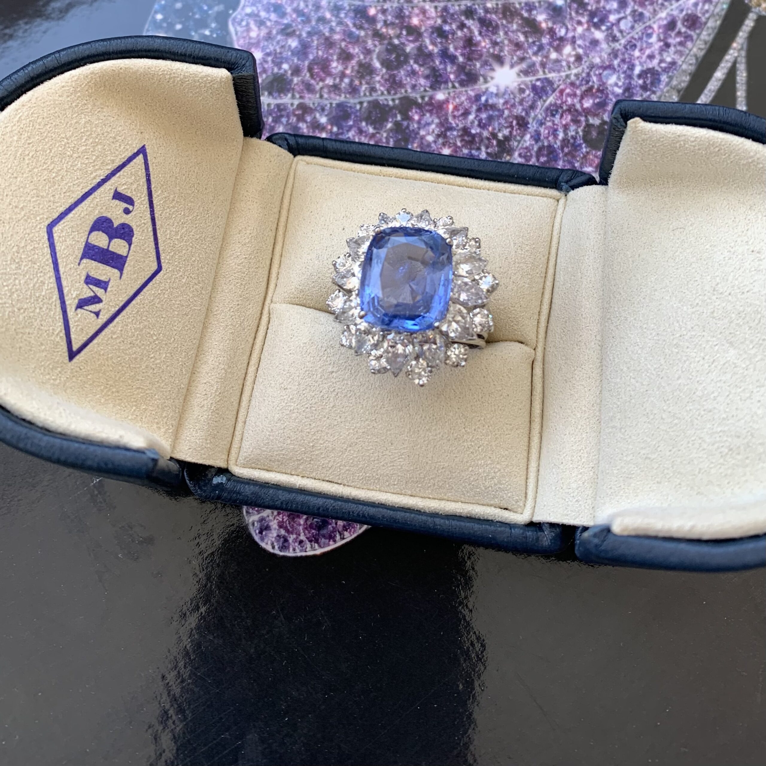 A blue stone is in the middle of a ring.