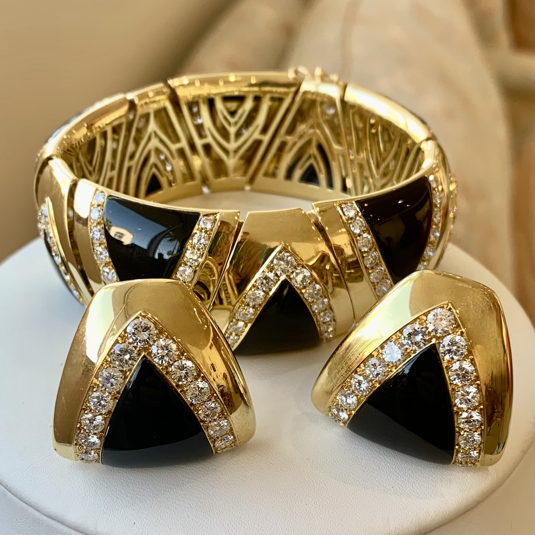 A bracelet and two earrings are on the table.