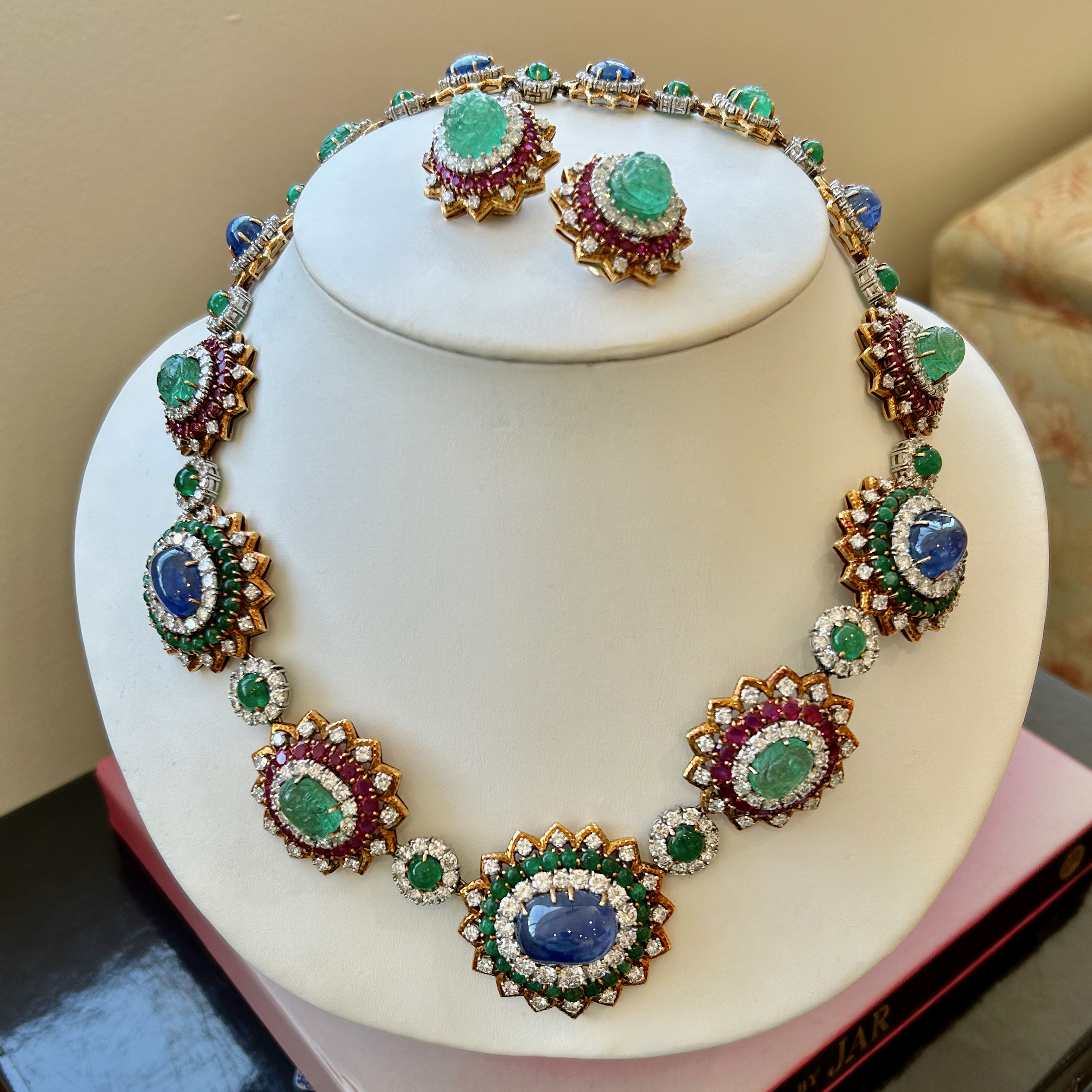 A necklace and earrings set on display.