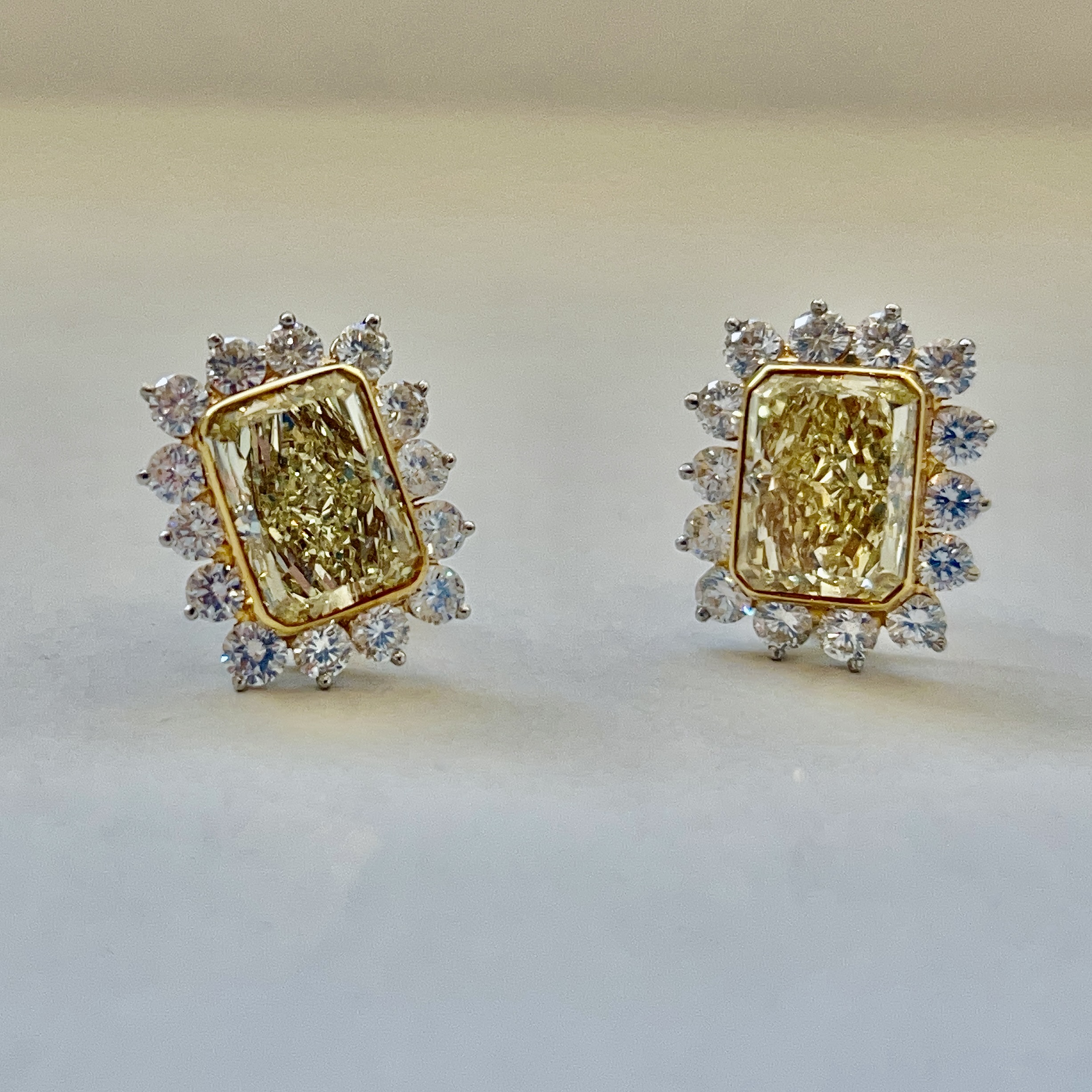 A Pair of Platinum and Fancy Yellow Diamond Earrings