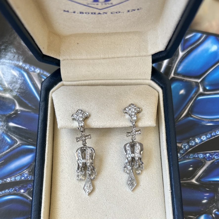 A pair of platinum and diamond drop earrings by Michael Beaudry