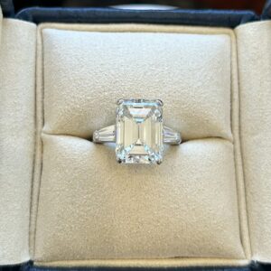 A Platinum and Emerald Cut Diamond Ring